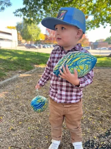 Boy With Ball in Hand