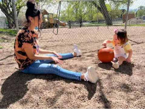 Mom and Daughter Playing With a Ball